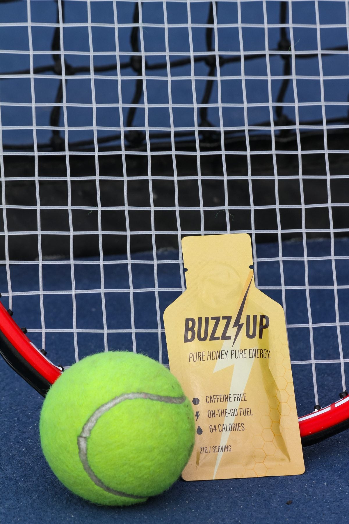 Buzz Up packet with a tennis ball on a racket